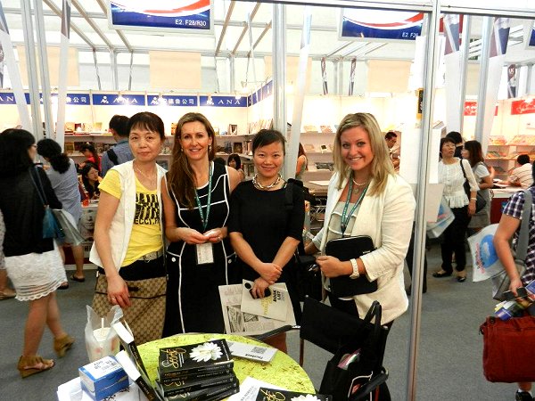Linda (right) with an Author-in-Booth and Chinese Publishers at Beijing